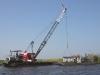 marsh crane loading airboat